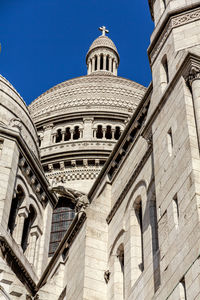 Low angle view of sacré coeur against sky