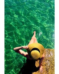 High angle view of woman sitting in swimming pool