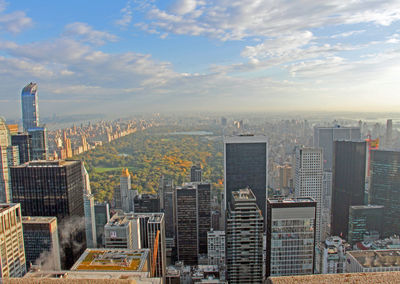 Cityscape against cloudy sky