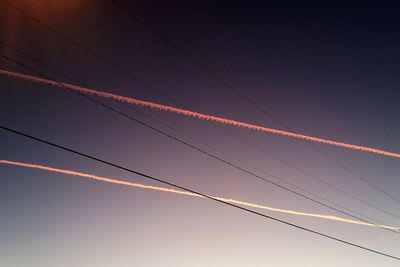 Low angle view of birds flying in sky