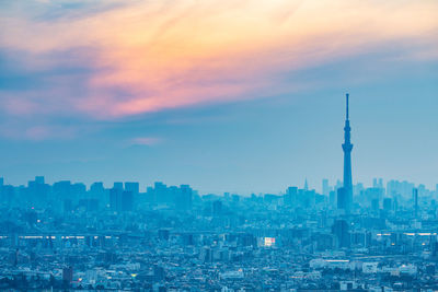 Cityscape against sky during sunset