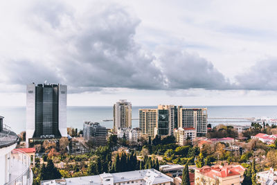 Modern buildings against sky in city