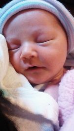 Close-up of cute baby girl sleeping