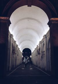 Man in corridor of building