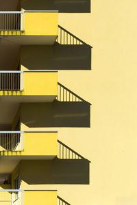 Low angle view of yellow staircase in building