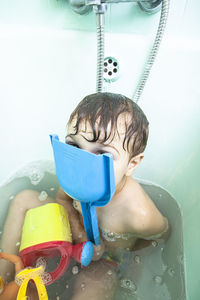 Portrait of shirtless boy in water