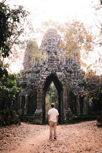 Rear view of woman standing in park