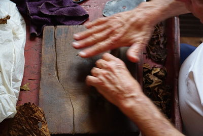 High angle view of man working on wood