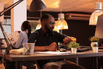 Young woman using laptop at table