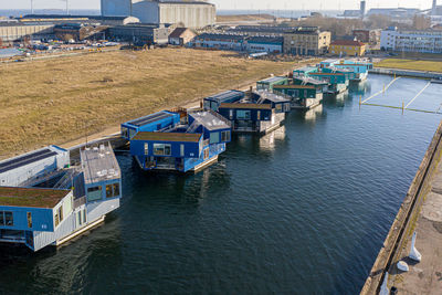 High angle view of harbor by buildings in city