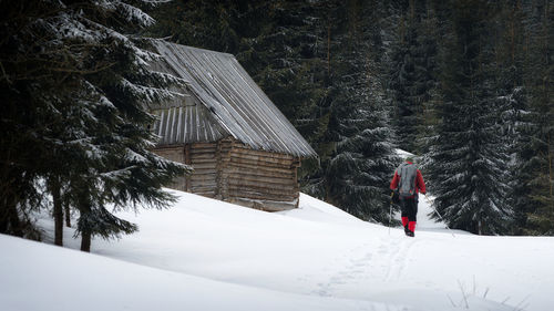 Man standing on snow covered land