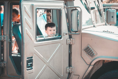 Portrait of boy in vehicle
