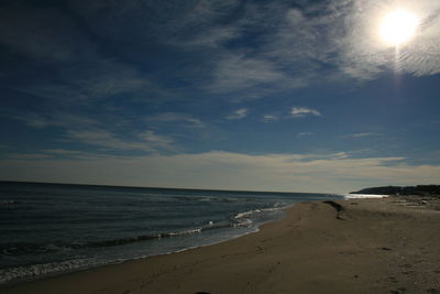 Scenic view of beach against sky during sunset