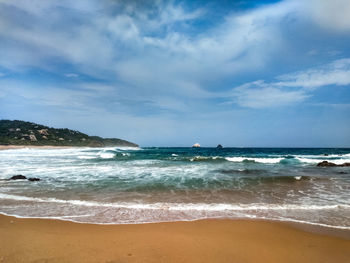 Scenic view of beach against sky