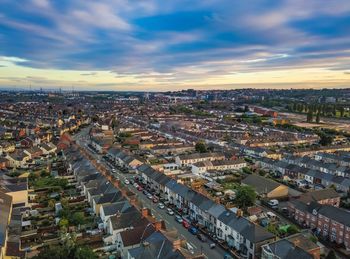 High angle shot of townscape against sky at sunset