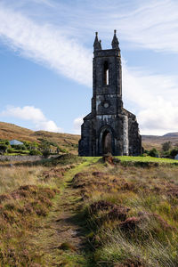 Church on field against sky