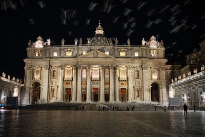 Facade of historic building at night