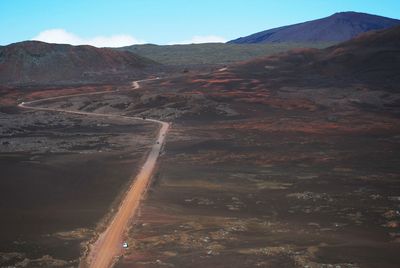 Aerial view of volcanic landscape against sky