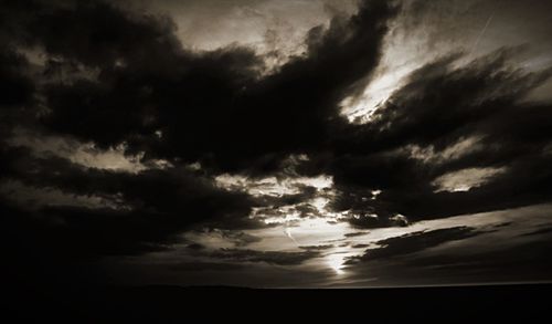 Low angle view of cloudy sky at sunset