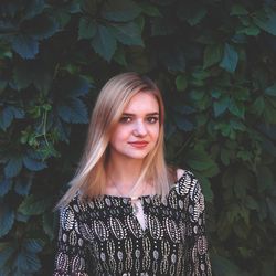 Portrait of smiling young woman standing outdoors