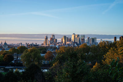 High angle view of trees and buildings against sky