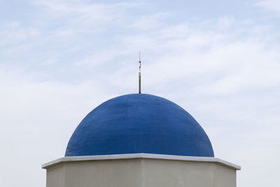 High section of building against cloudy sky