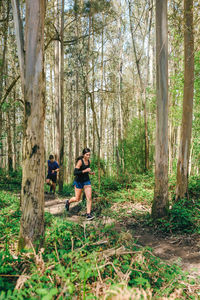 People running in forest