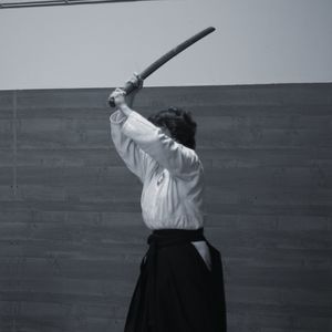 Rear view of man standing on wall