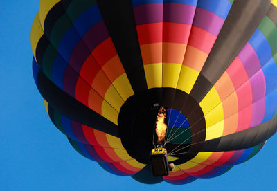 Low angle view of colorful hot air balloon against clear sky