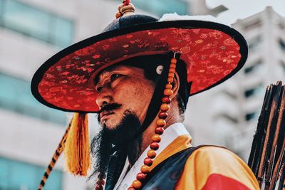 Close-up of man wearing hat