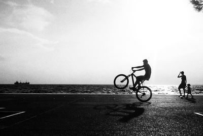 Man riding bicycle on road