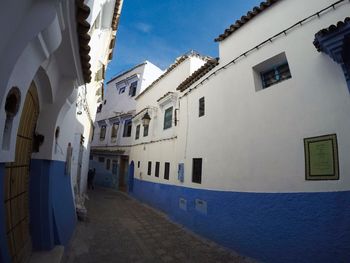 View of buildings against blue sky