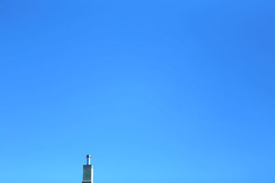 Low angle view of building against blue sky