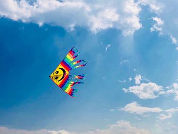 Low angle view of kite flying against sky