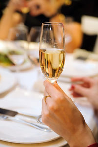 Close-up of woman holding wineglass