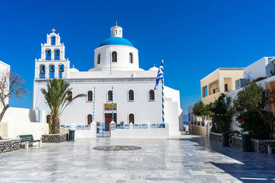 Orthodox church in oia, santorini, greece on a summer day. summer 2020, during coronavirus pandemic