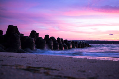 Scenic view of sea against sky at sunset