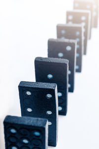 Close-up of computer keyboard on table against white background