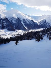 Scenic view of mountains against sky during winter