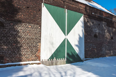 Snow covered wall of house