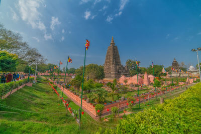 Panoramic view of temple and buildings against sky