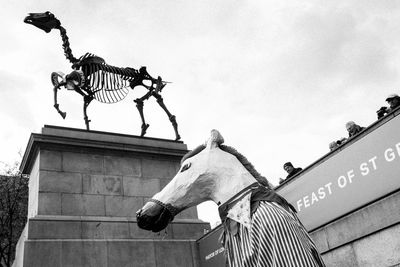 Low angle view of statue against sky