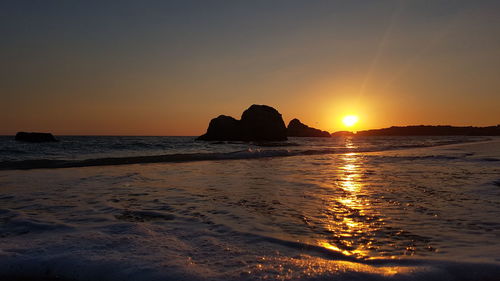 Scenic view of sea against sky during sunset