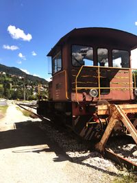 Train on railroad track against sky