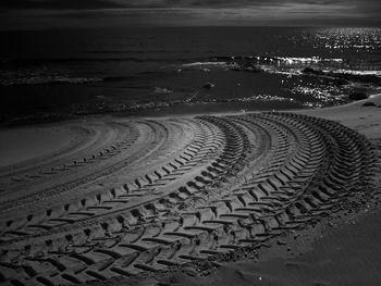 Surface level of tire prints on sand