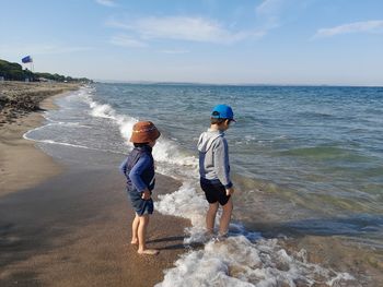 Kids walking on beach