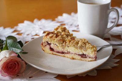 Close-up of cheesecake served on table