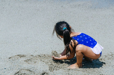 Full length of girl on sand at beach