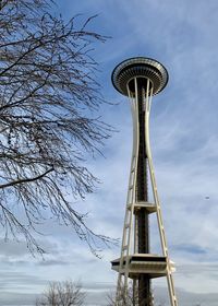 Low angle view of communications tower against sky