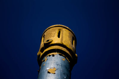 Low angle view of building against blue sky